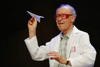 Herschbach, winner of the 1986 Nobel Prize for Chemistry, throws a paper airplane during the 23rd First Annual Ig Nobel Prize ceremony at Harvard University in Cambridge