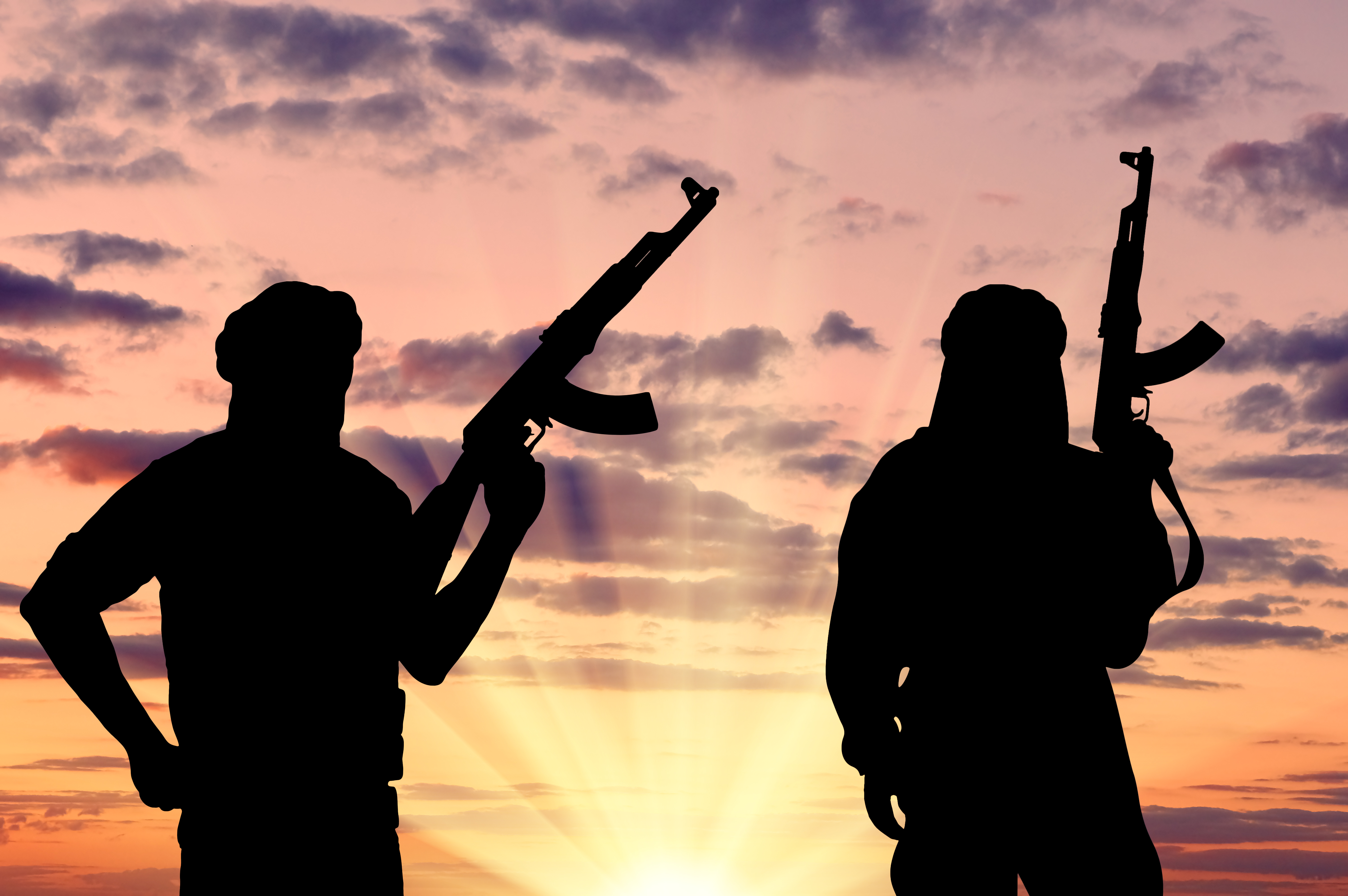 Silhouette of two terrorists